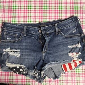 Silver Jeans Co. Blue Distressed Denim Shorts with Flag Patch